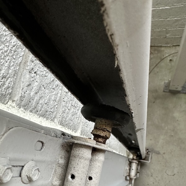 Put rollers  back in track and service door